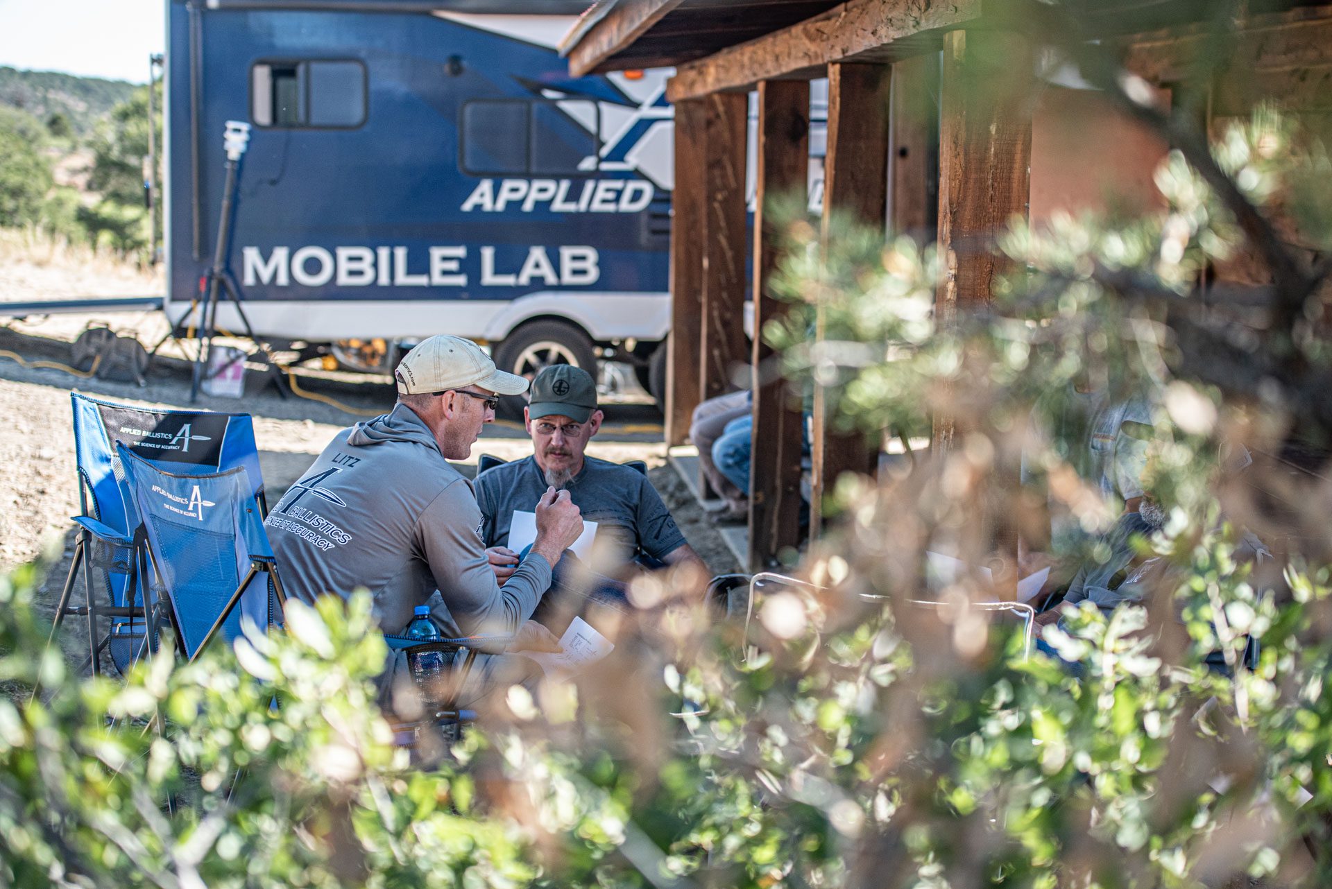 Applied Ballistics Mobile Lab, Bryan Litz talks about aerodynamic drag and ballistics of projectiles over long range distances. Bryan Litz explains ballistics to a group of extreme long range shooters at King of 2 Mile competition in Raton, NM